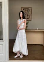 Sleeveless White Embossed Midi Dress Flowy Ruffled Hem